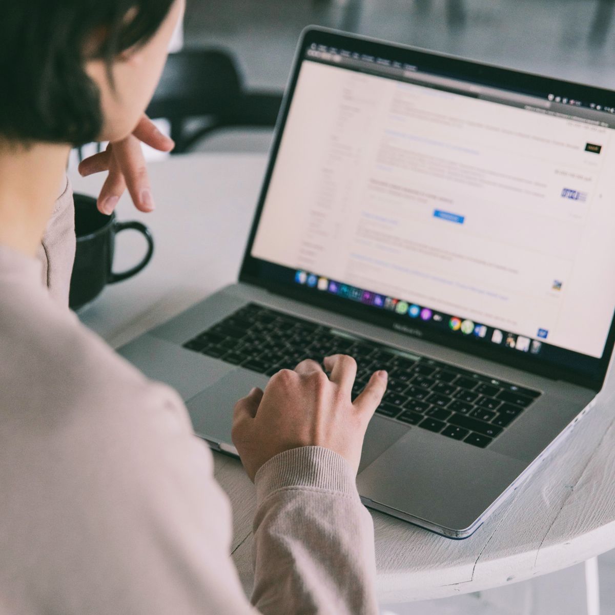Woman at computer looking at search results.