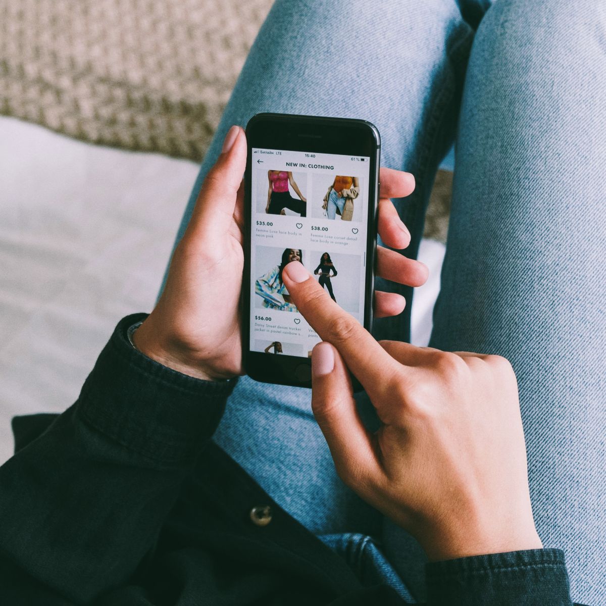 male holding phone looking at search results.